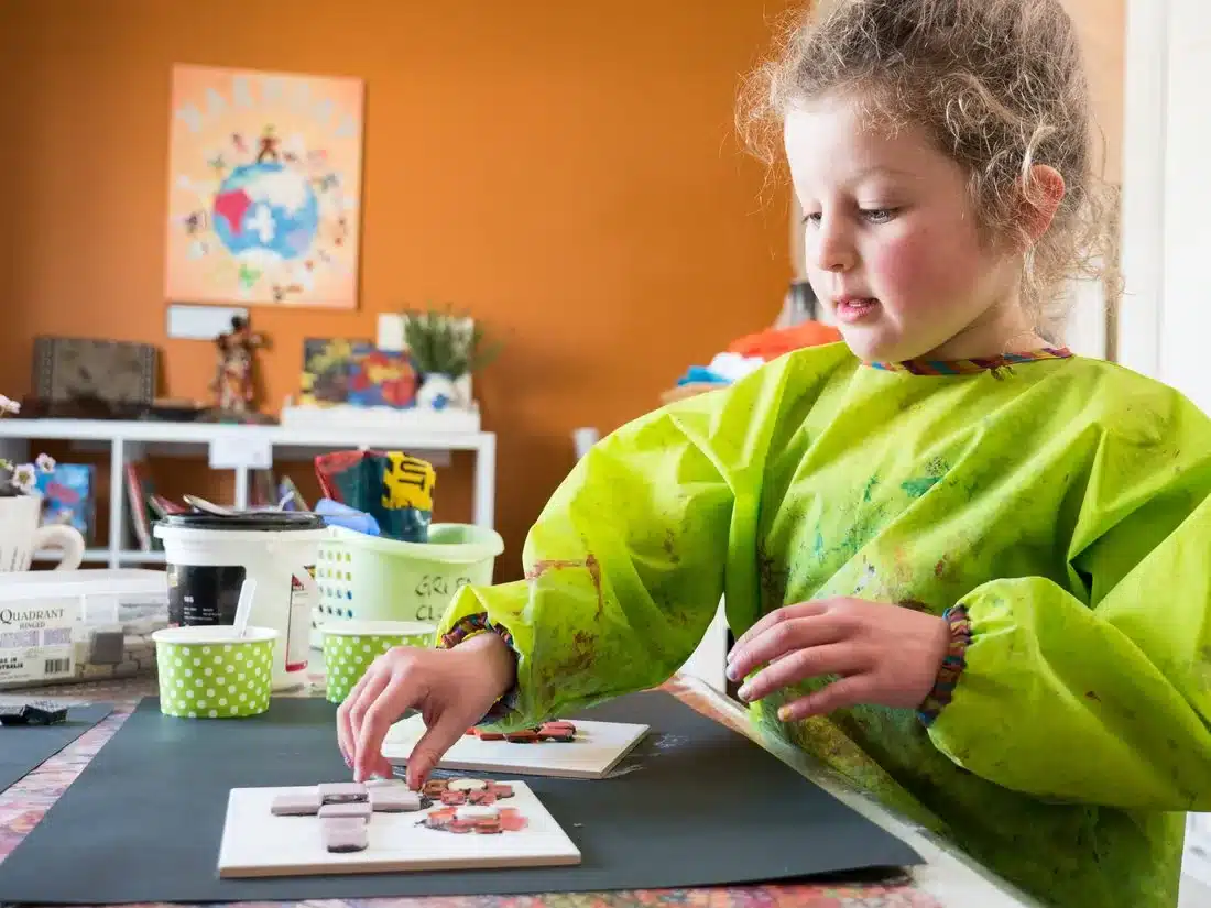 Child exploring hands-on creative play in the Reggio Emilia approach