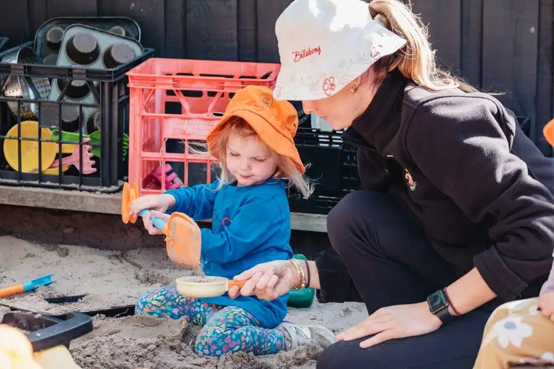 Child playing outdoors in the environmental sustainability program