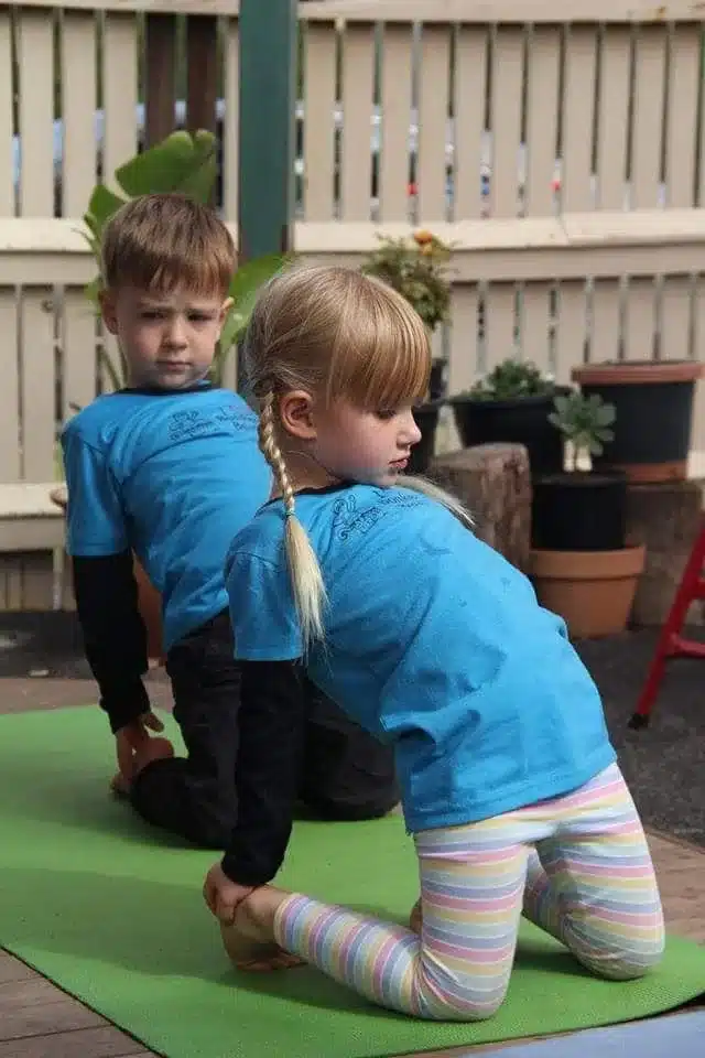 Children enjoying a wellbeing and movement activity outdoors at Bonkers Beat